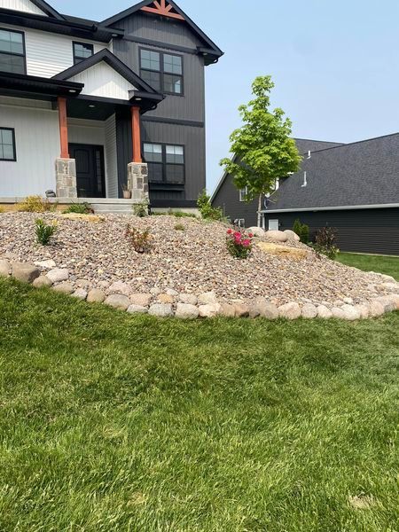 A large house with a lush green lawn in front of it.