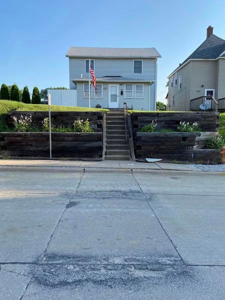 A house with stairs leading up to the front door