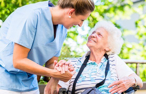 Nurse Holding Hand of Senior Woman — Kenosha, WI — Home Care Services