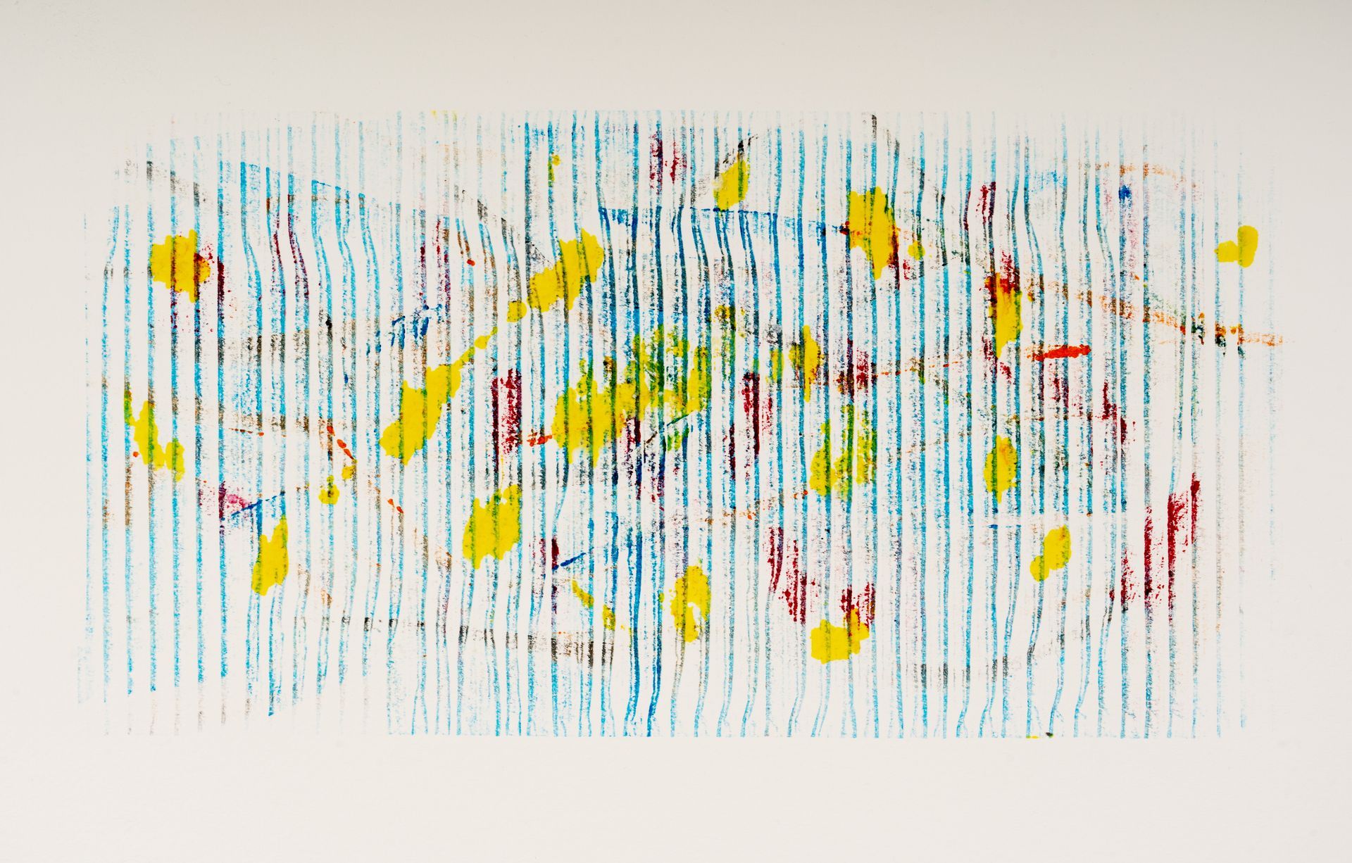 A close up of a colorful painting on a white surface.