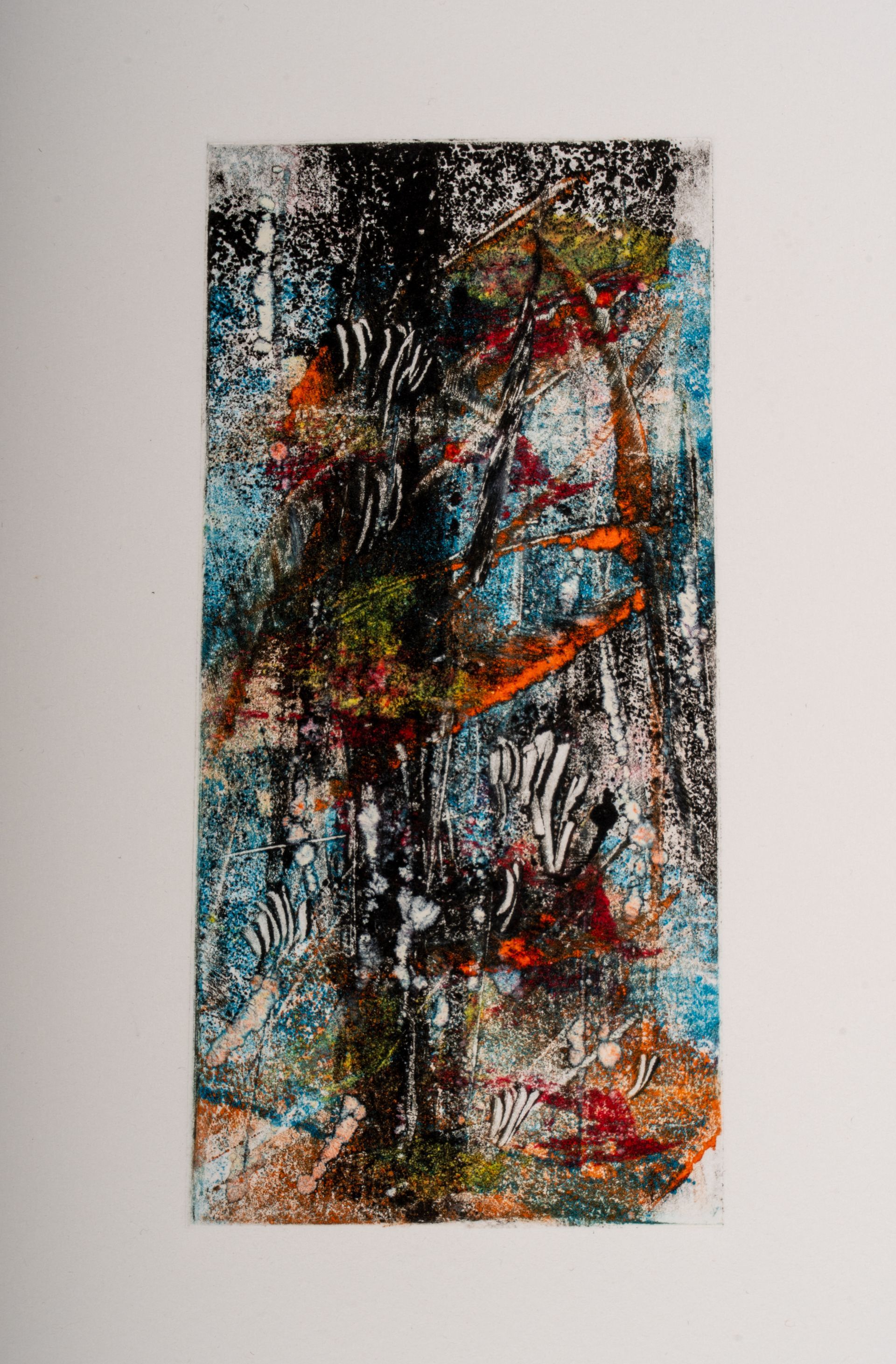 A colorful painting is hanging on a white wall.