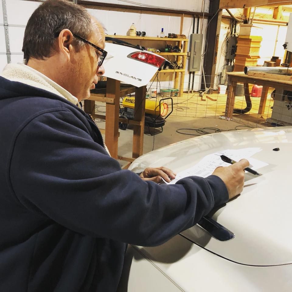 A Man Writing - Aurora, CO - Elevate Hail & Dent Repair