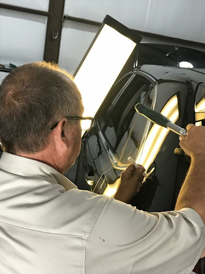 A Man Fixing Dent - Aurora, CO - Elevate Hail & Dent Repair