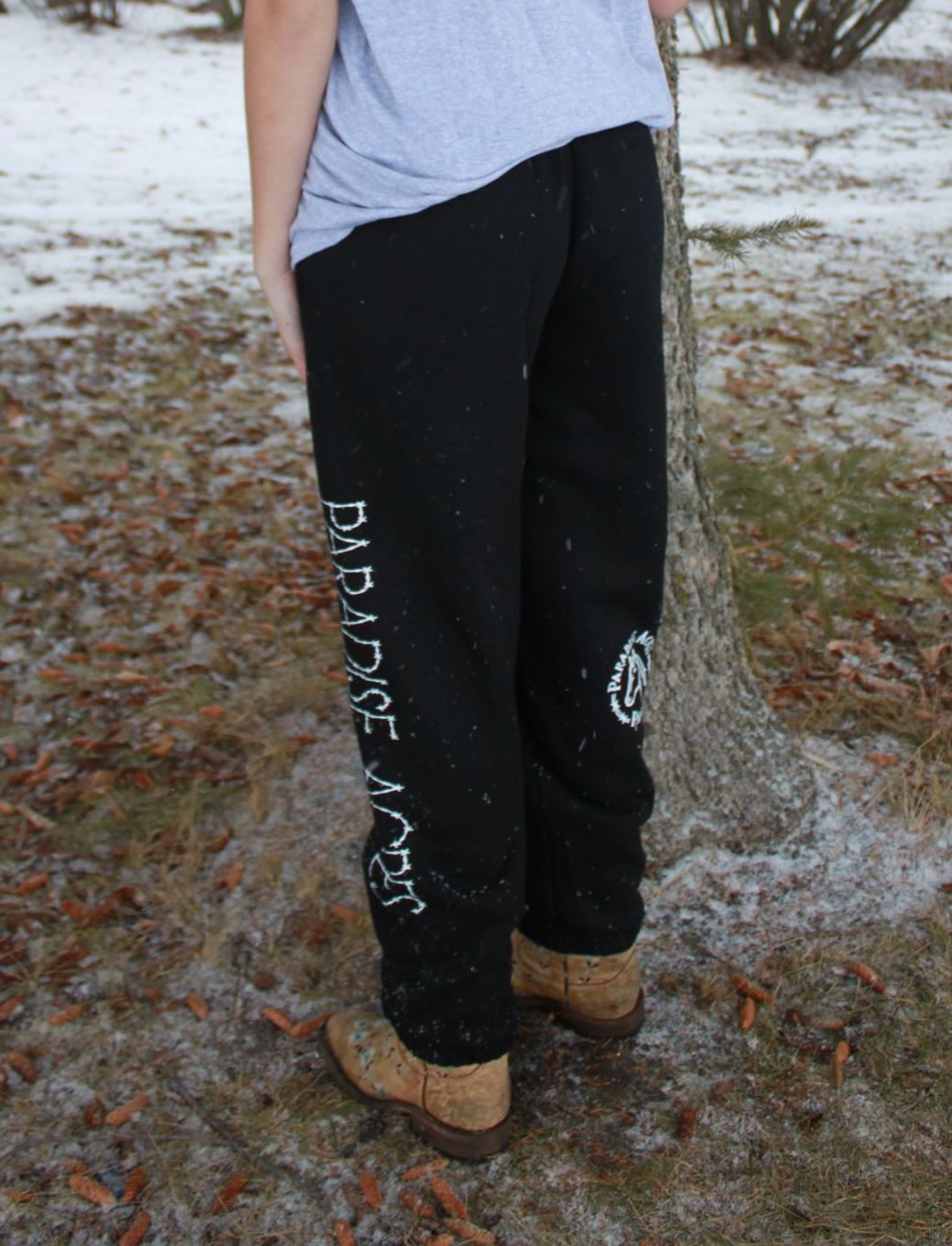 Person in black sweatpants with 