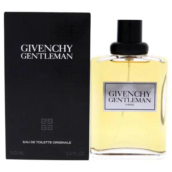 A bottle of givenchy gentleman cologne next to its box