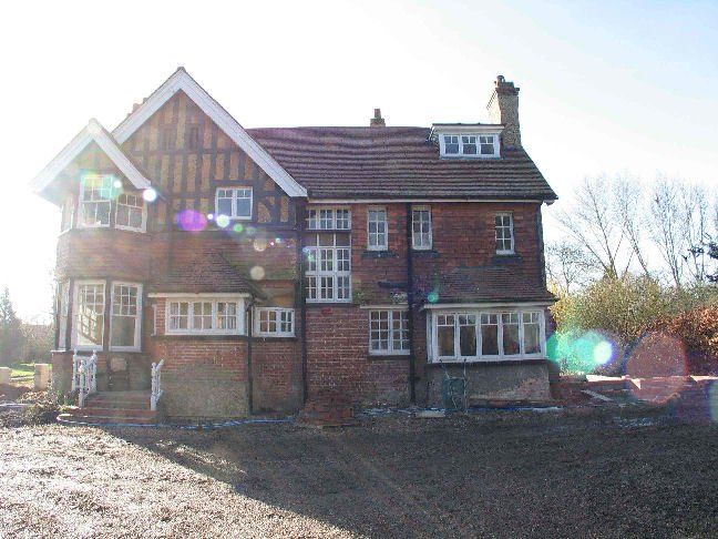 A large brick house with a lot of windows