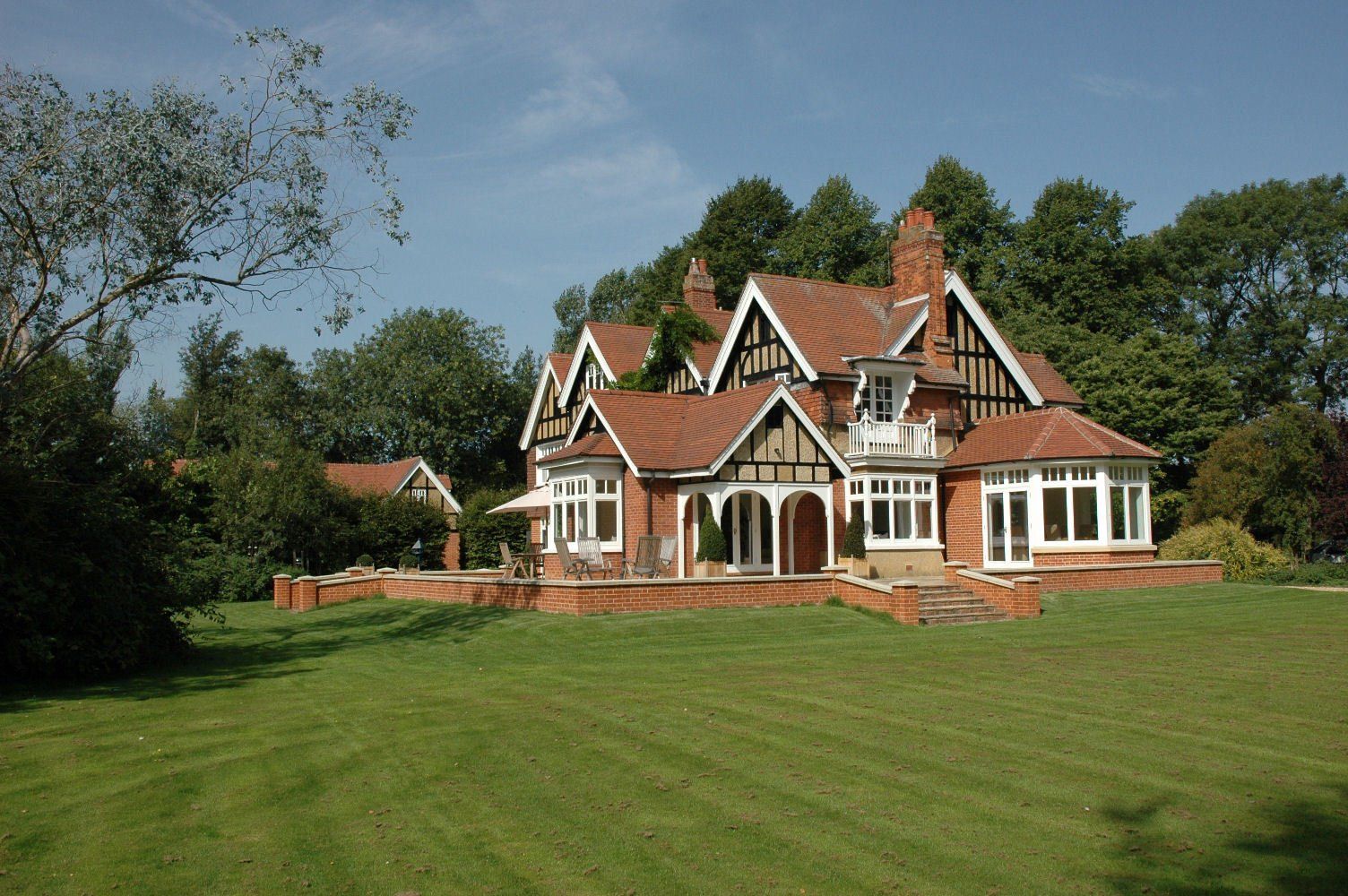 A large house with a large lawn in front of it