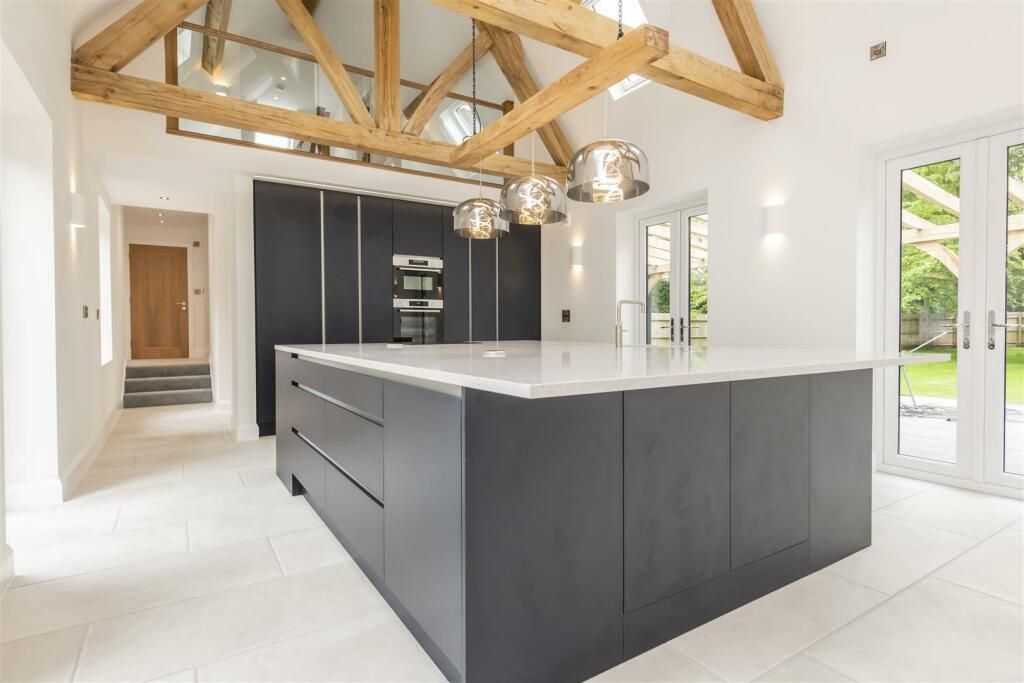 A large kitchen with a large island in the middle