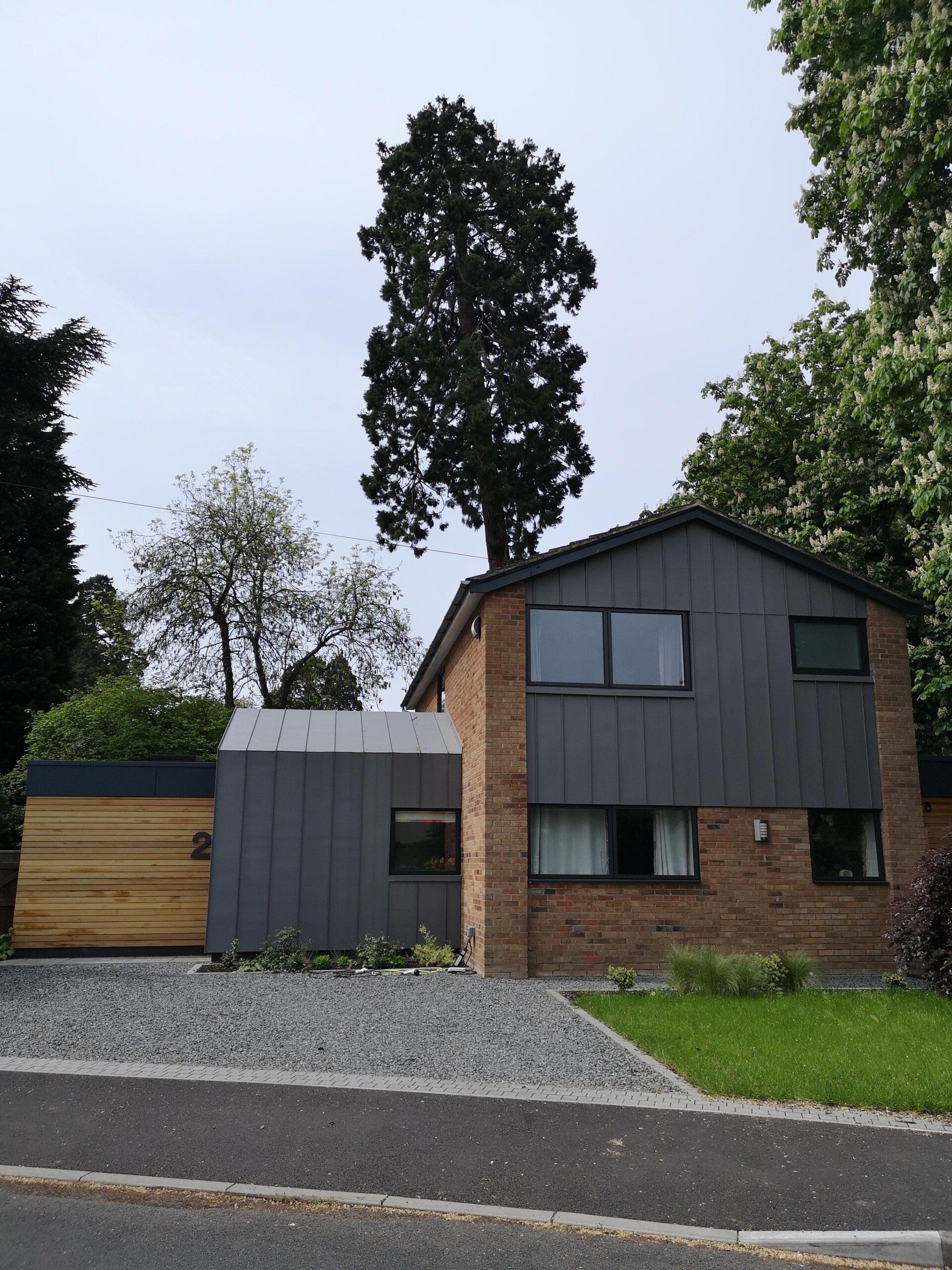 A house with a tree in front of it