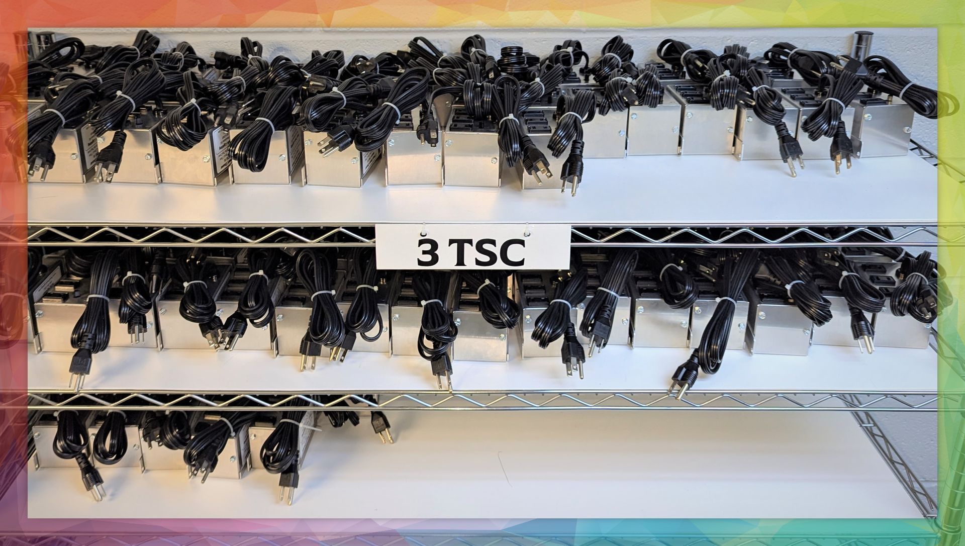 A display of 3 tsc keys on a rainbow background