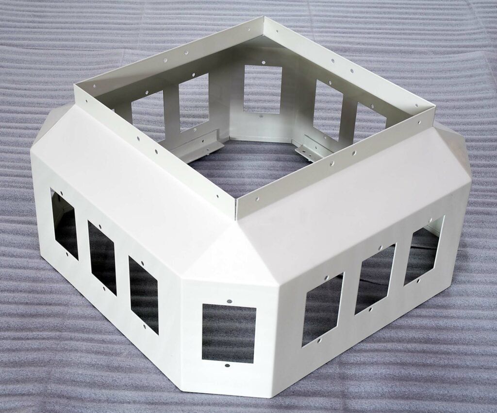 A white box with holes in it looks like a house