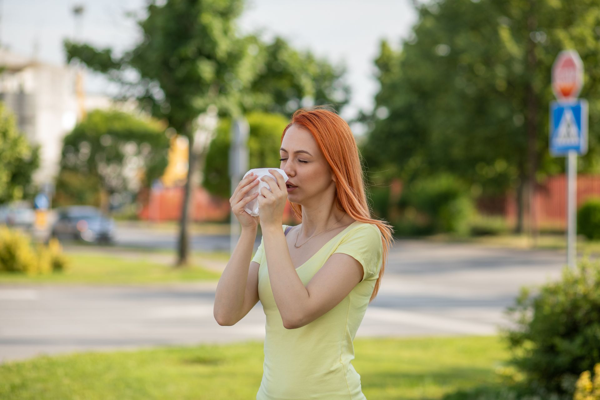 A woman experiencing nasal allergy.