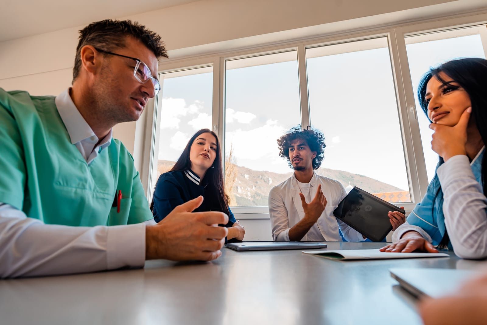 a group of physicians in a meeting