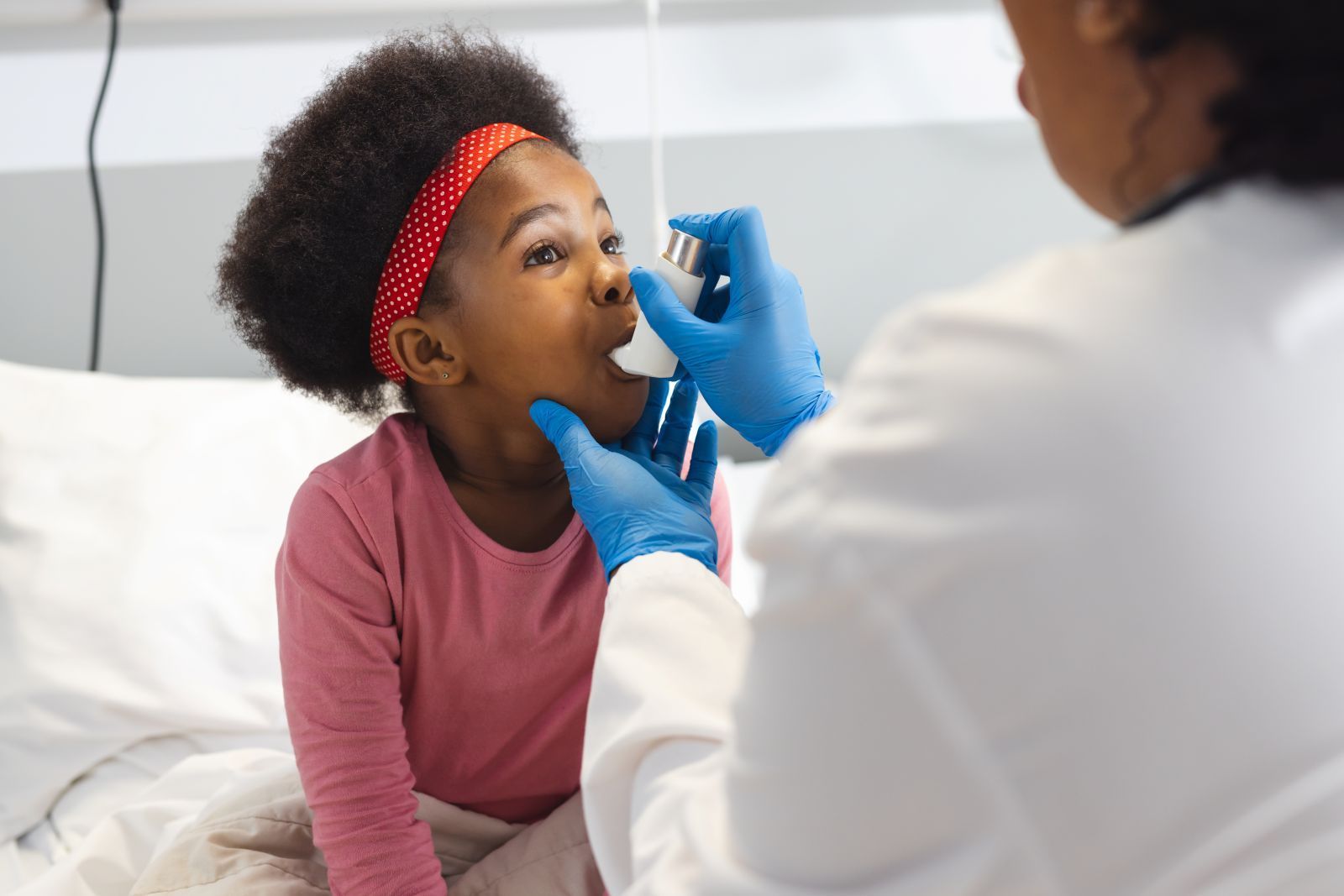 female-doctor-treating-the-asthma-of-a-pediatric-patient
