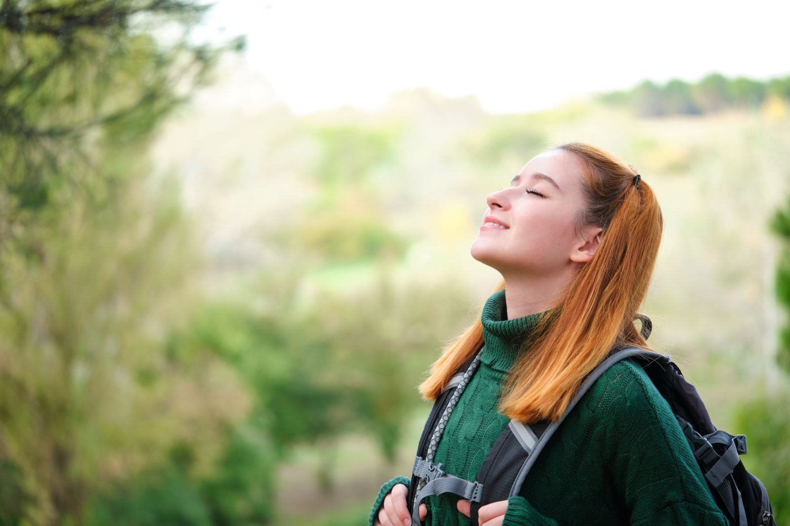 female-hiker-breathing-fresh-air-in-the-mountain
