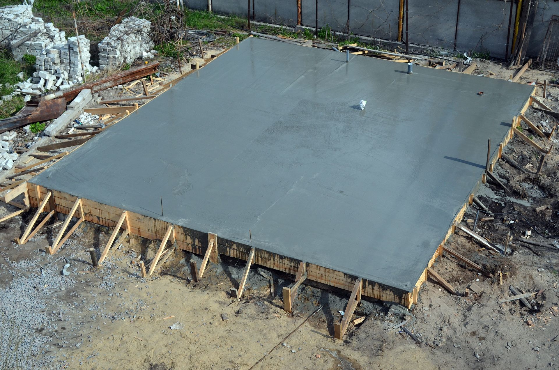 A large concrete slab is sitting on top of a wooden frame.