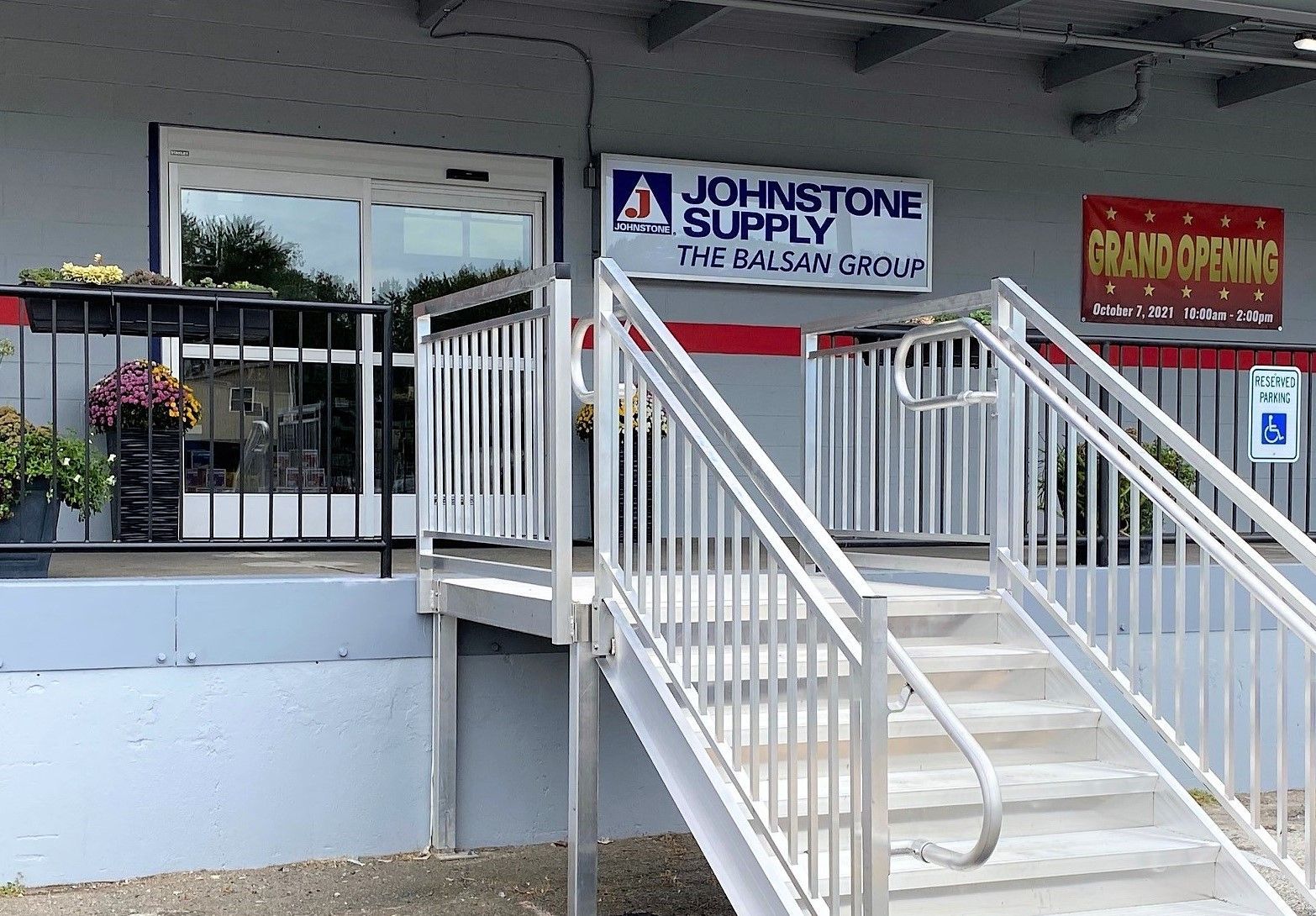 Stairs leading up to a johnstone supply store