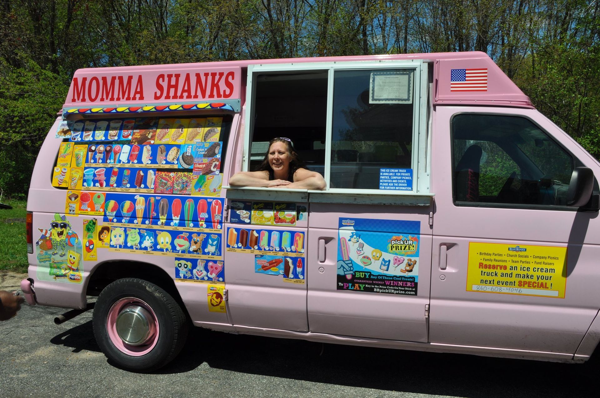 A pink ice cream truck labeled