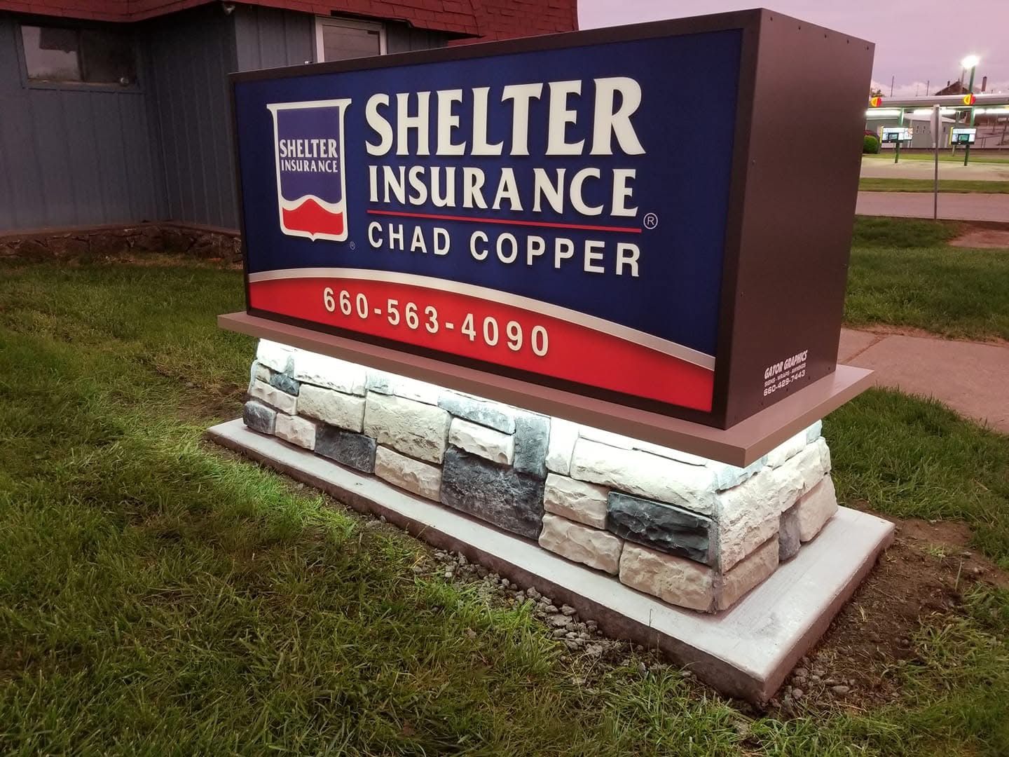 SIGN SHOP BROKERS MONUMENT SIGN-SIGN CABINET LIGHTED MOUNTED TO STONE PLATFORM