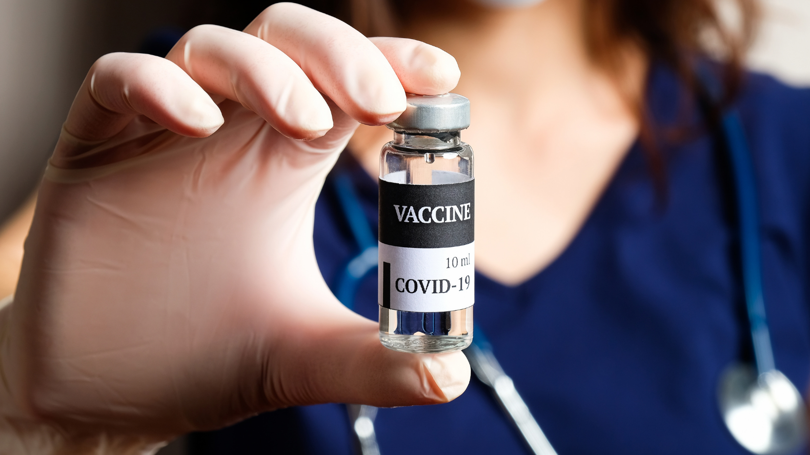 A Nurse Holding a COVID-19 Vaccine