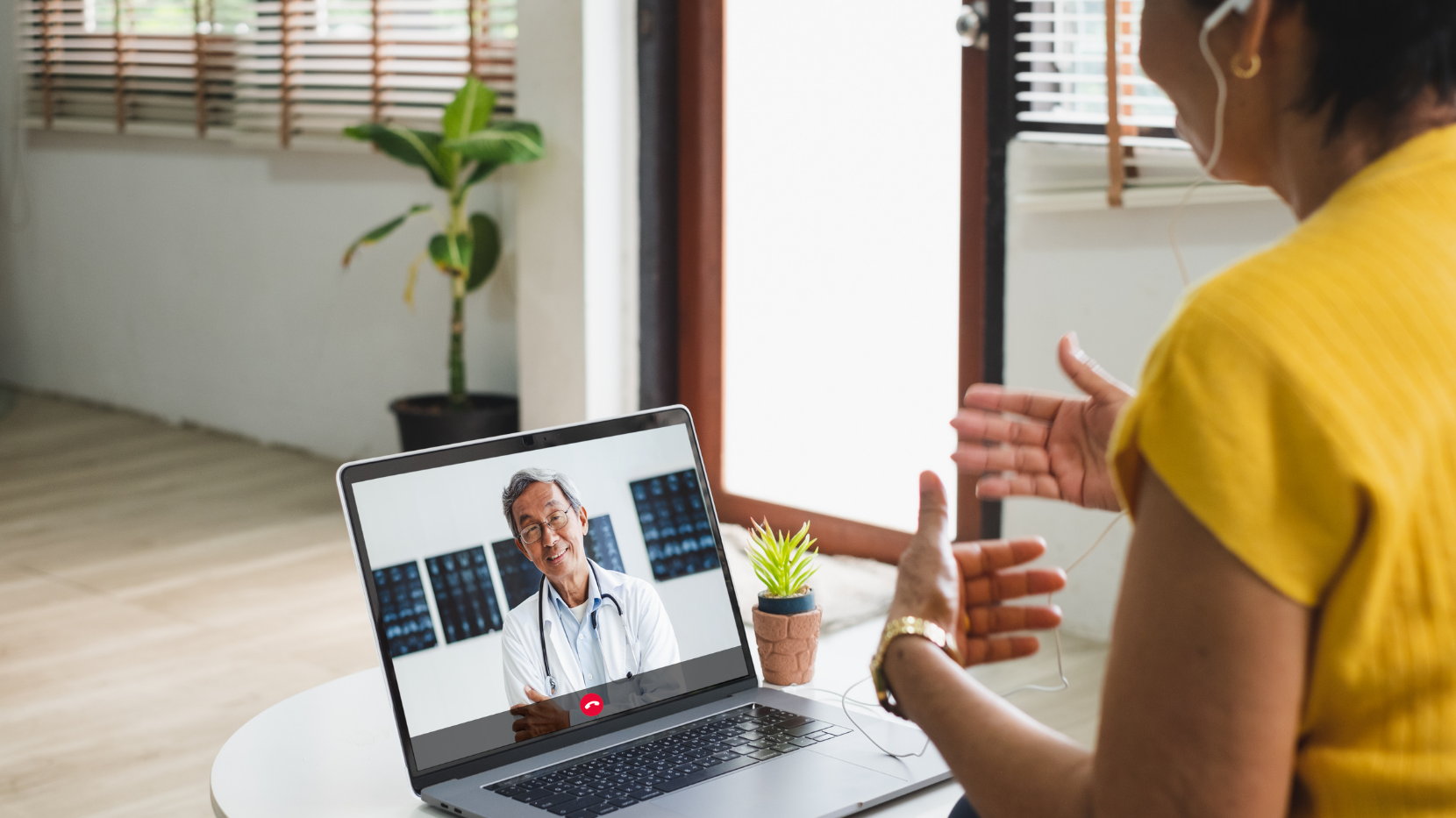 Woman using Telehealth to have a virtual call with her doctor