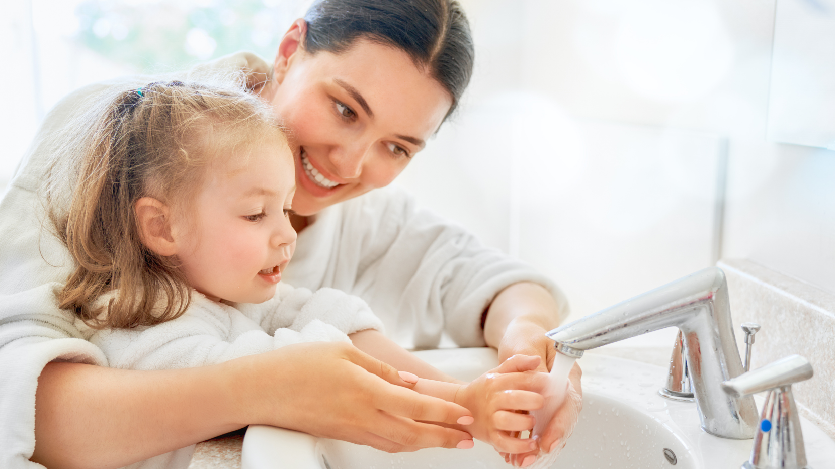 Mother and Daughter Washing their Hands