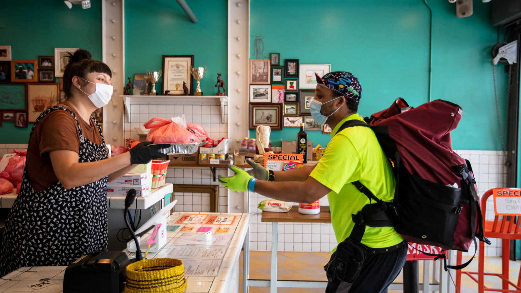 A Food Delivery Man Grabbing Takeout During the Pandemic
