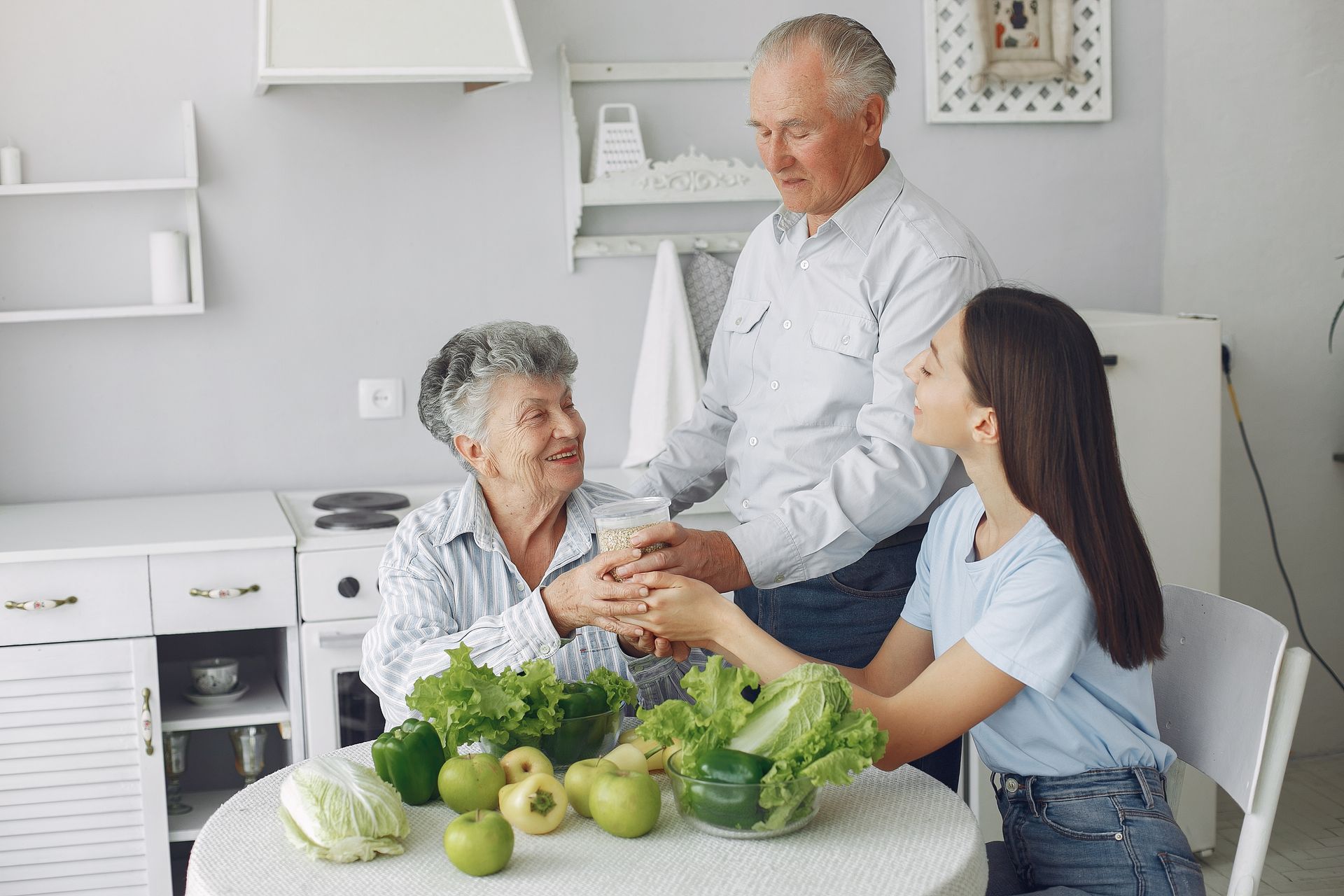 Elderly couple with granddaughter sharing tips to stay healthy