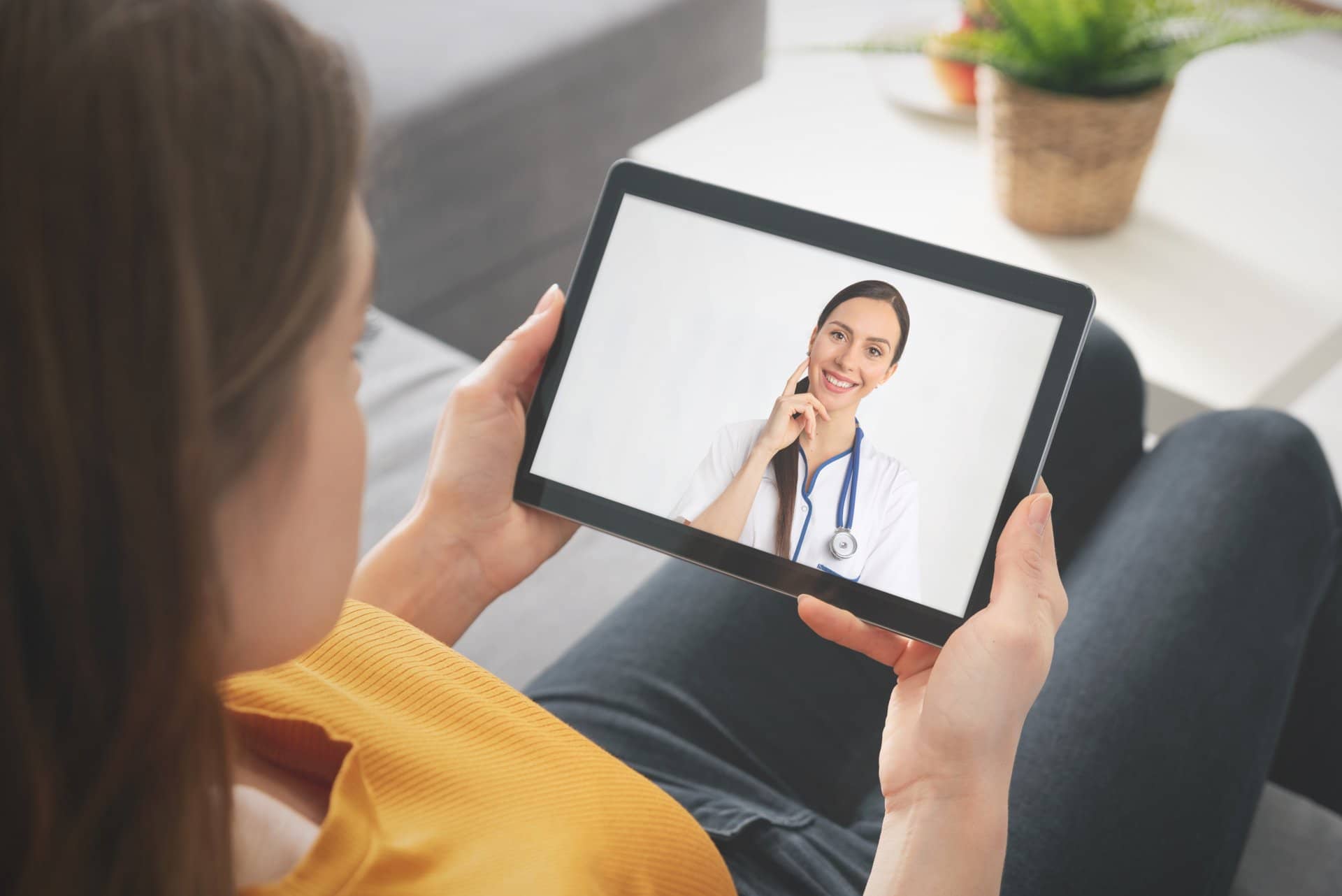 Patient in a remote telehealth call with her doctor