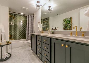 Green tile gives beauty and unique charm to this basement bathroom