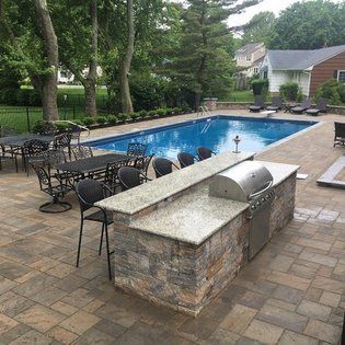 Pool with Outdoor Kitchen — Middletown, NJ — Precision Landscape Contractors