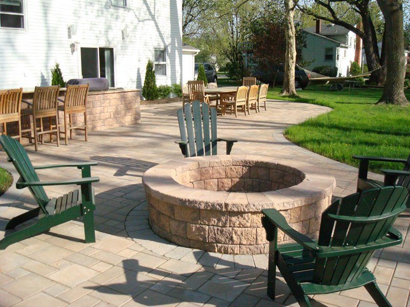 Stone Patio with Chairs — Middletown, NJ — Precision Landscape Contractors