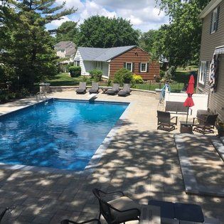 Swimming Pool with Resting Chairs — Middletown, NJ — Precision Landscape Contractors