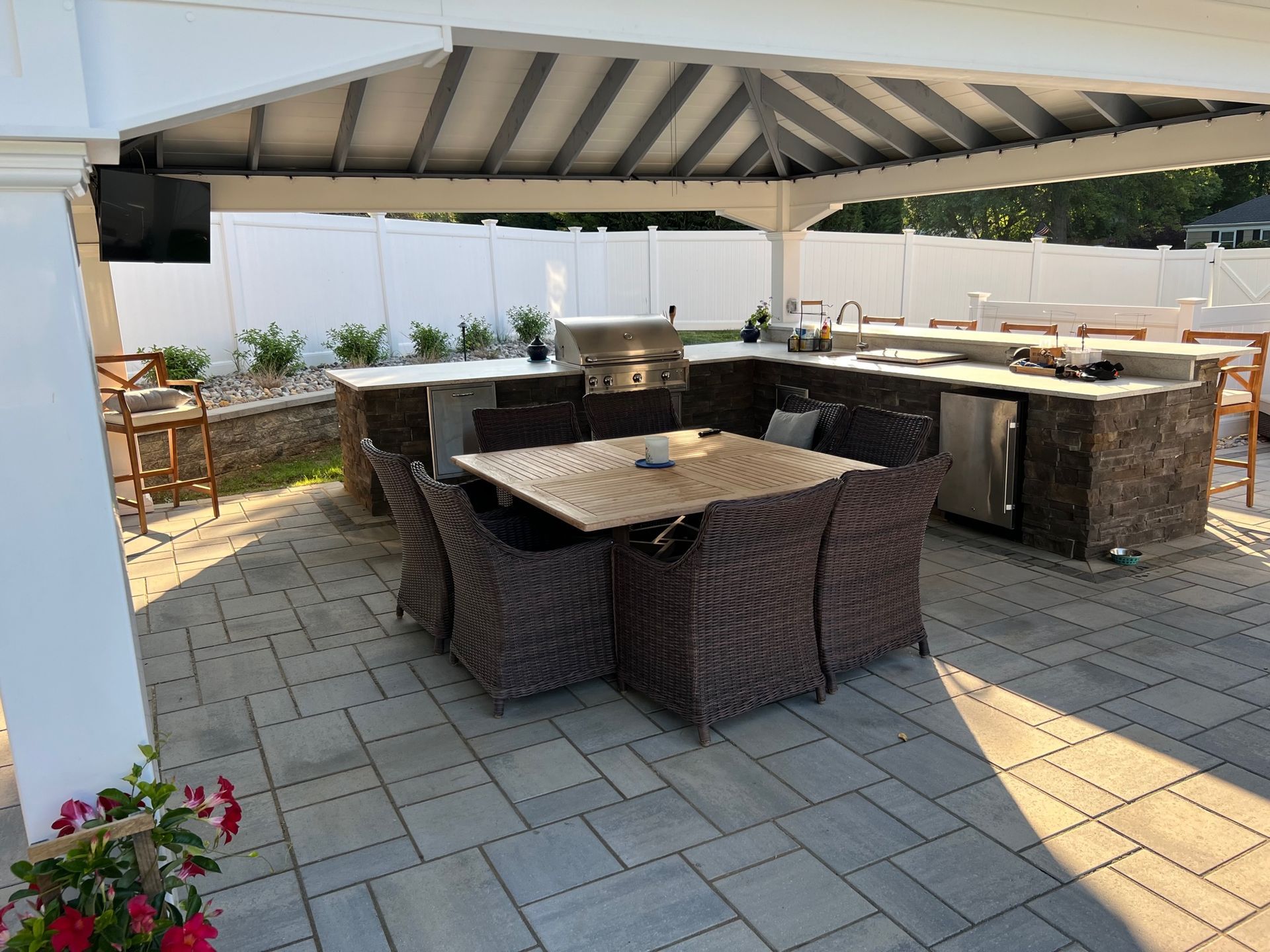 Outdoor Dining Area With Rattan Chairs — Middletown, Nj — Precision Landscape Contractors
