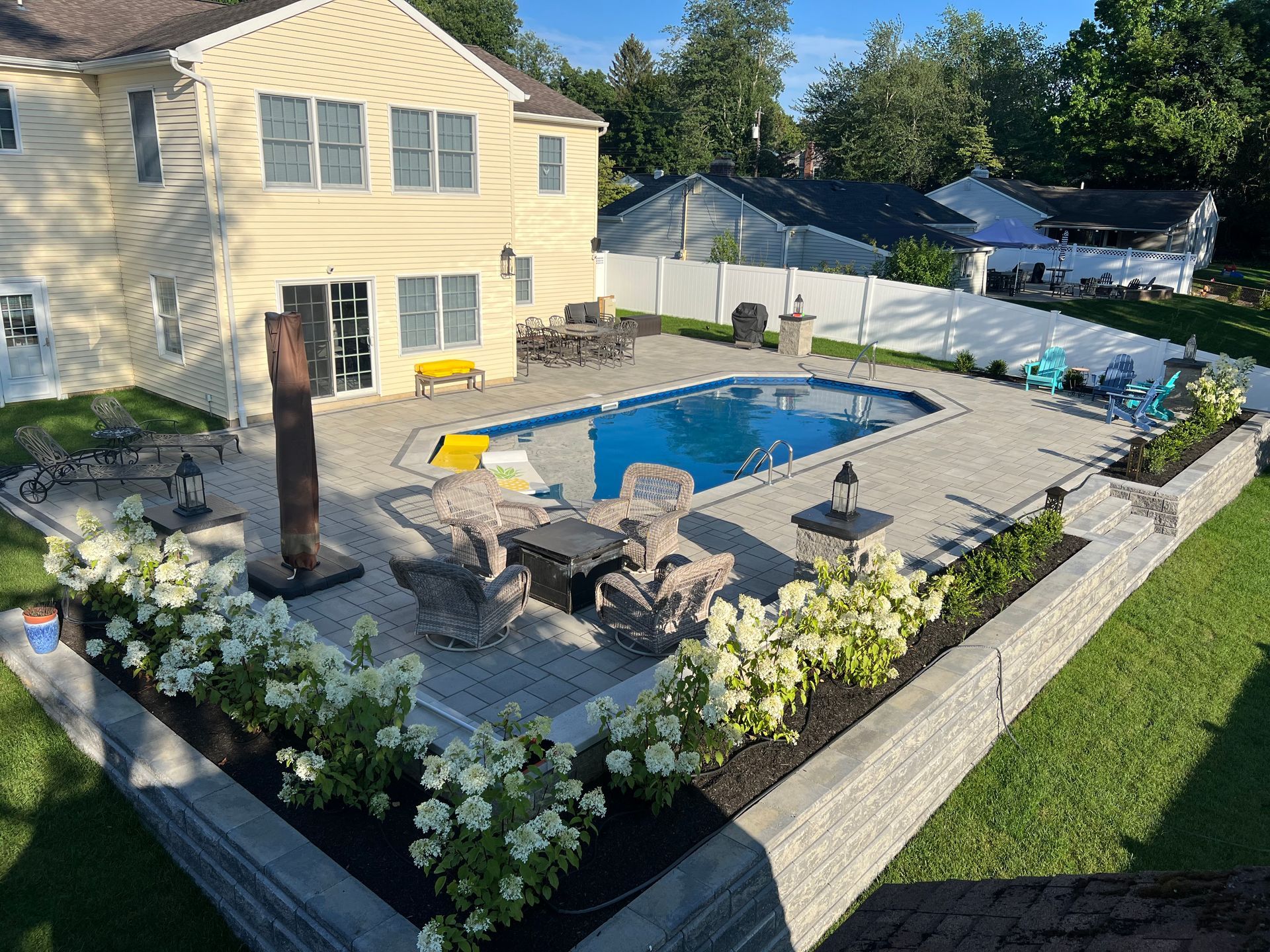 Blue Pool & Flwoers — Precision Landscape Contractors
