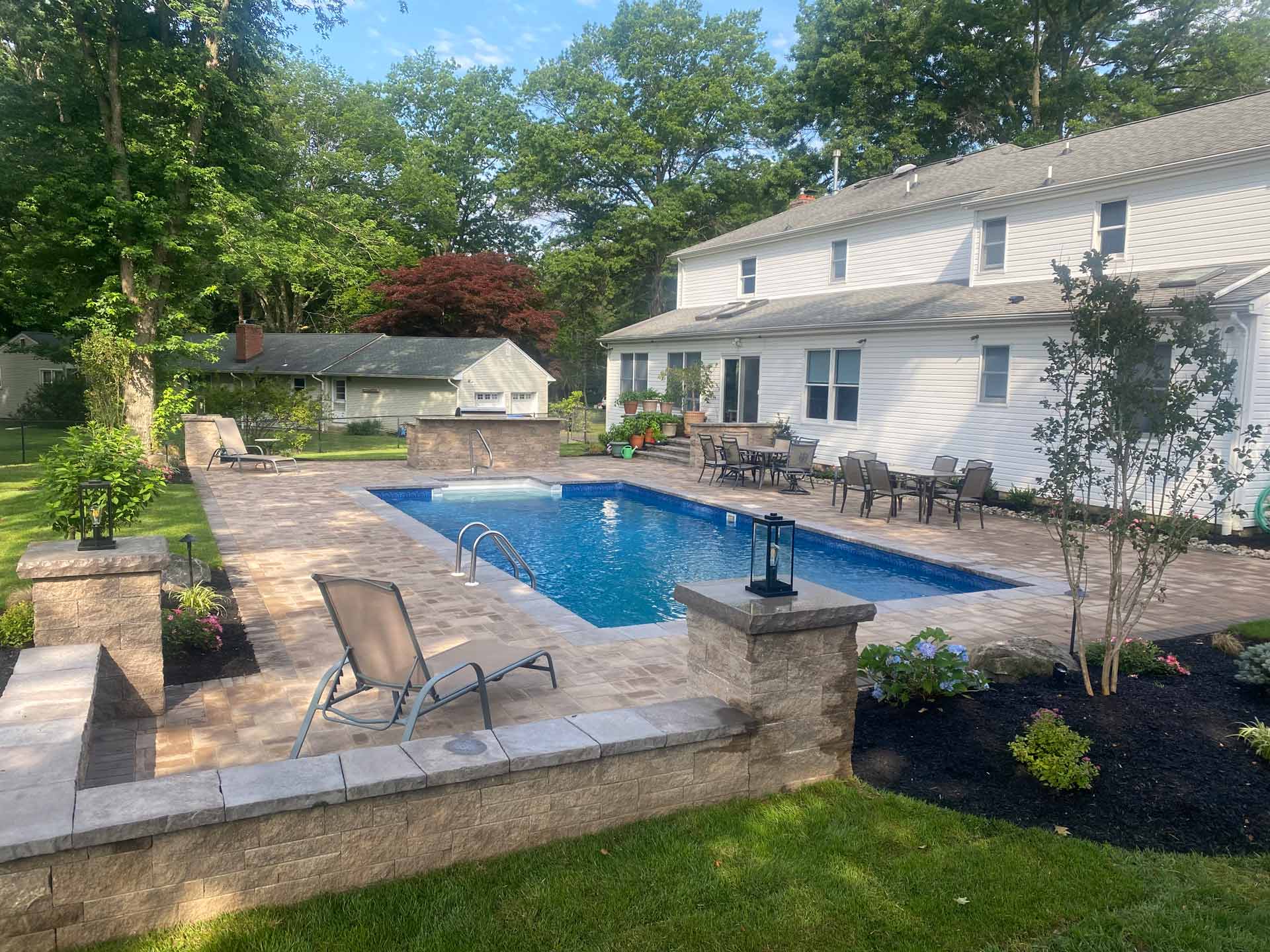 Beautiful White House Exterior with Swimming Pool — Middletown, Nj — Precision Landscape Contractors