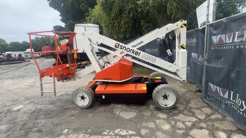 A Crane Is Parked In A Parking Lot Next To A Fence – Caboolture, QLD - R & R Hire Services