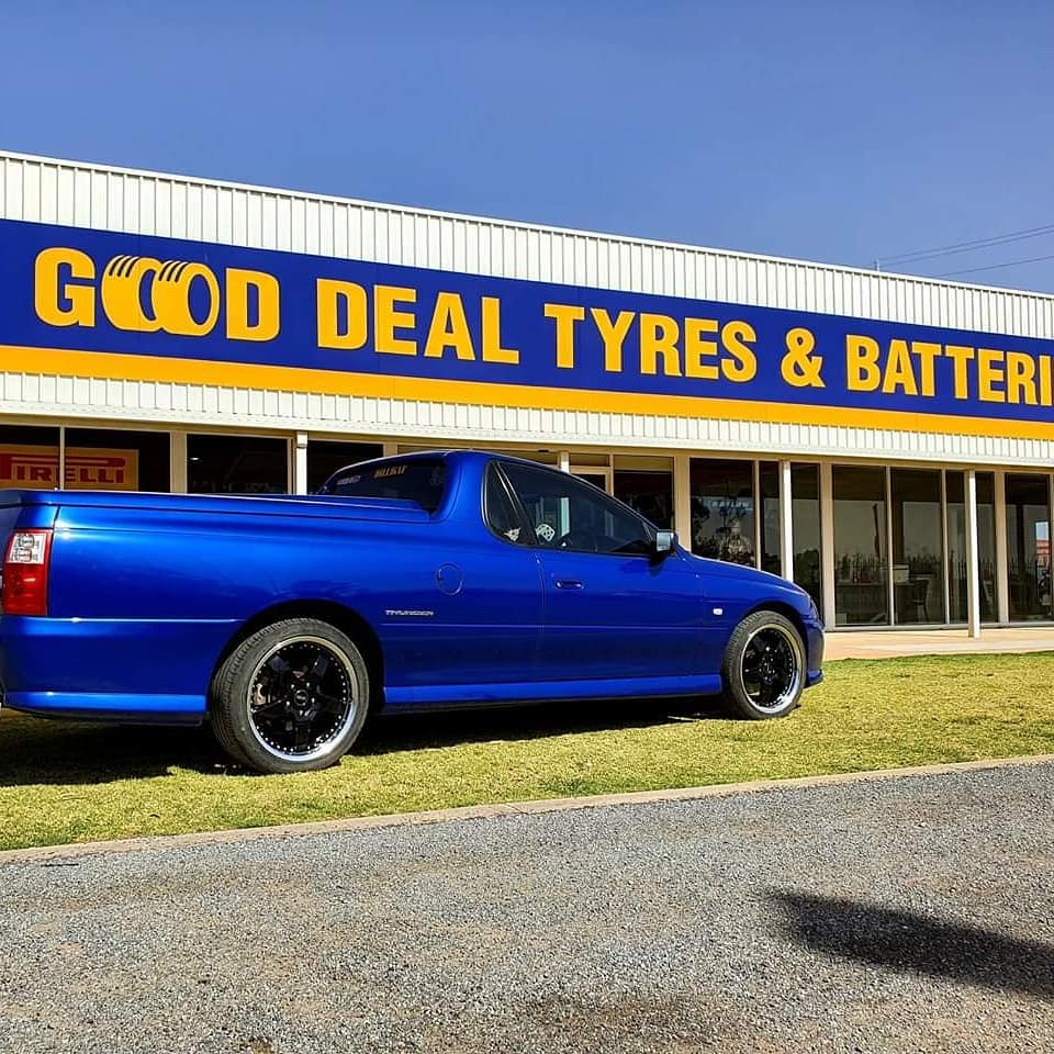 Blue Car in Front of a Shop — Mildura & Sunraysia, VIC — Good Deal Tyres