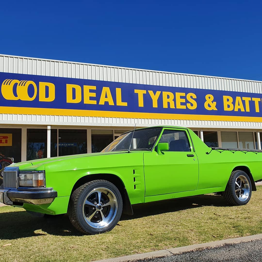 Green Car in Front of a Shop — Mildura & Sunraysia, VIC — Good Deal Tyres