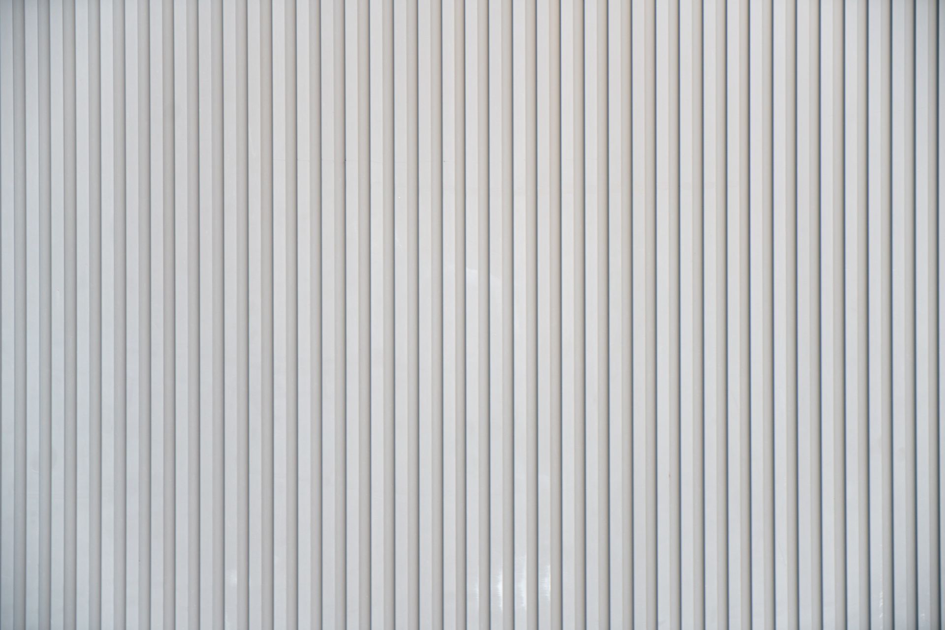 White vertical ribbed wall.