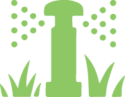 Green sprinkler watering a lawn.