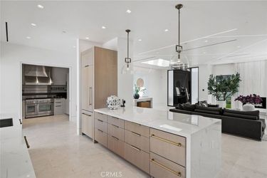 There is a large island in the middle of the kitchen.