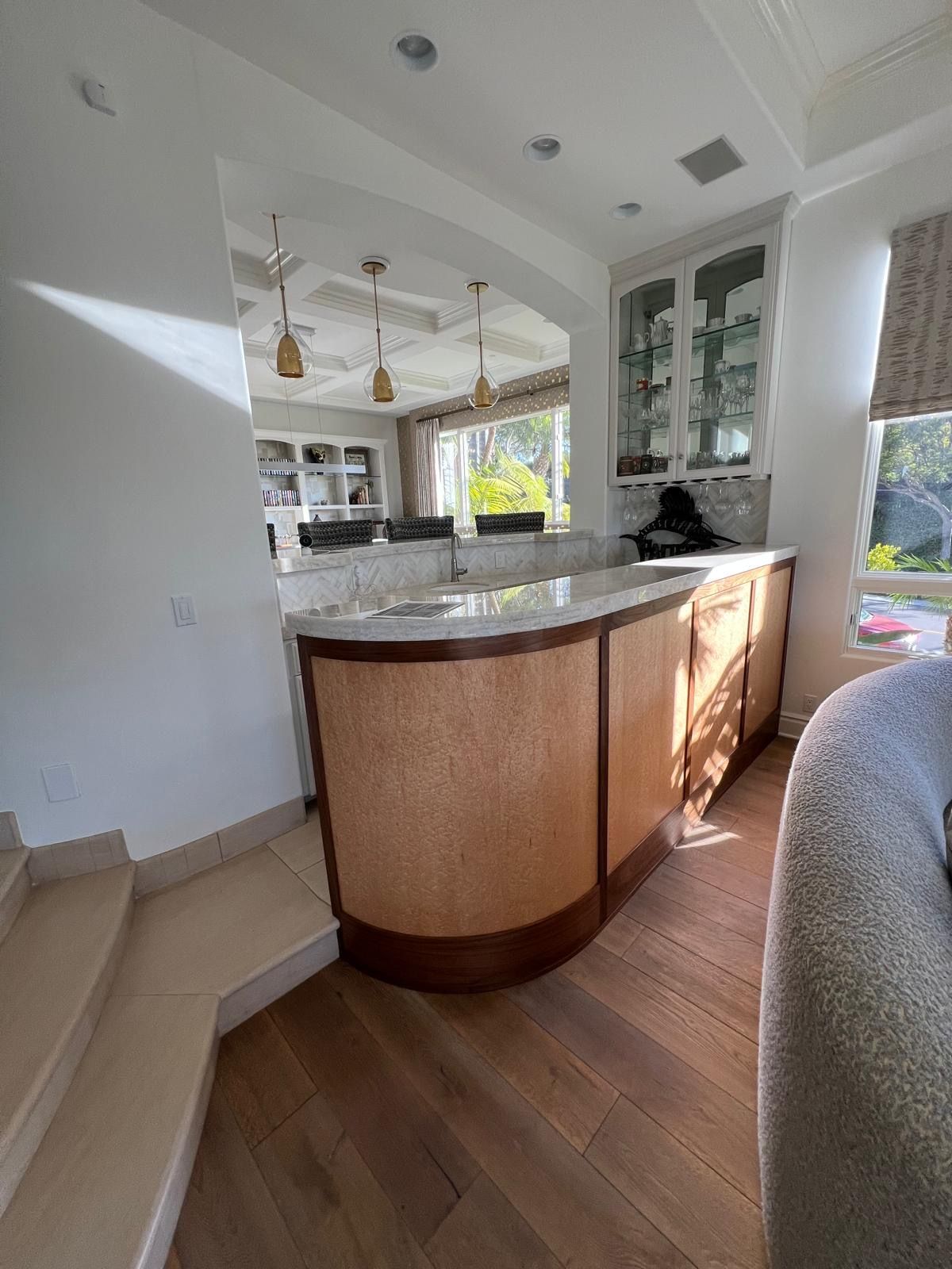A kitchen with a large island in the middle of the room.