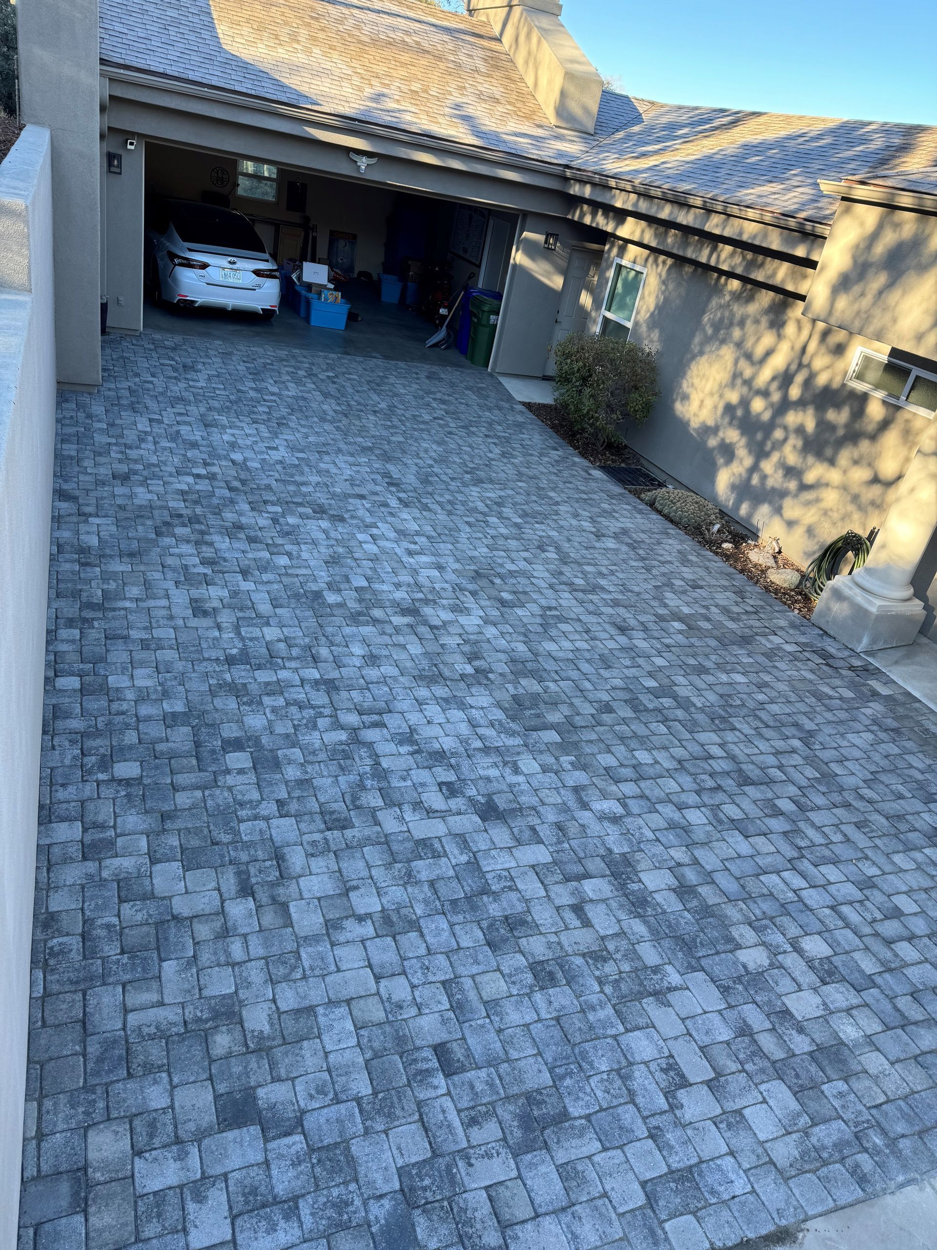 A house with a concrete walkway leading to it