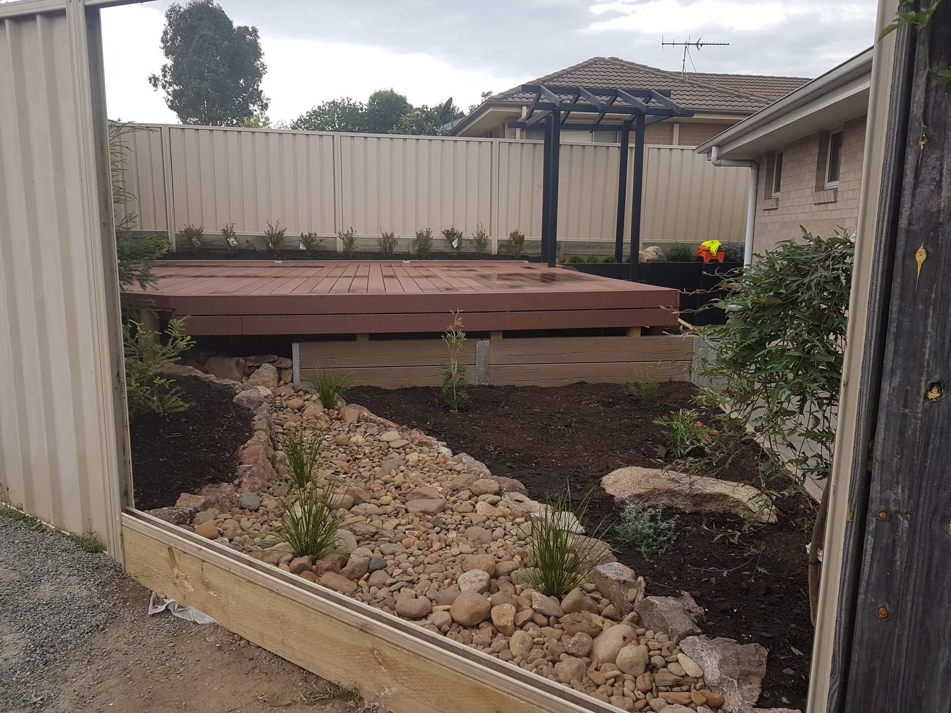 A Sandbox with A Fence in The Background — Creating Eden Landscaping In Lake Macquarie, NSW