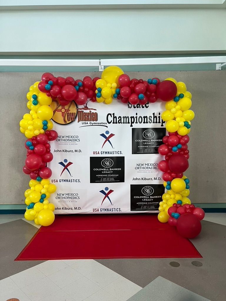 A banner with balloons around it that says championship