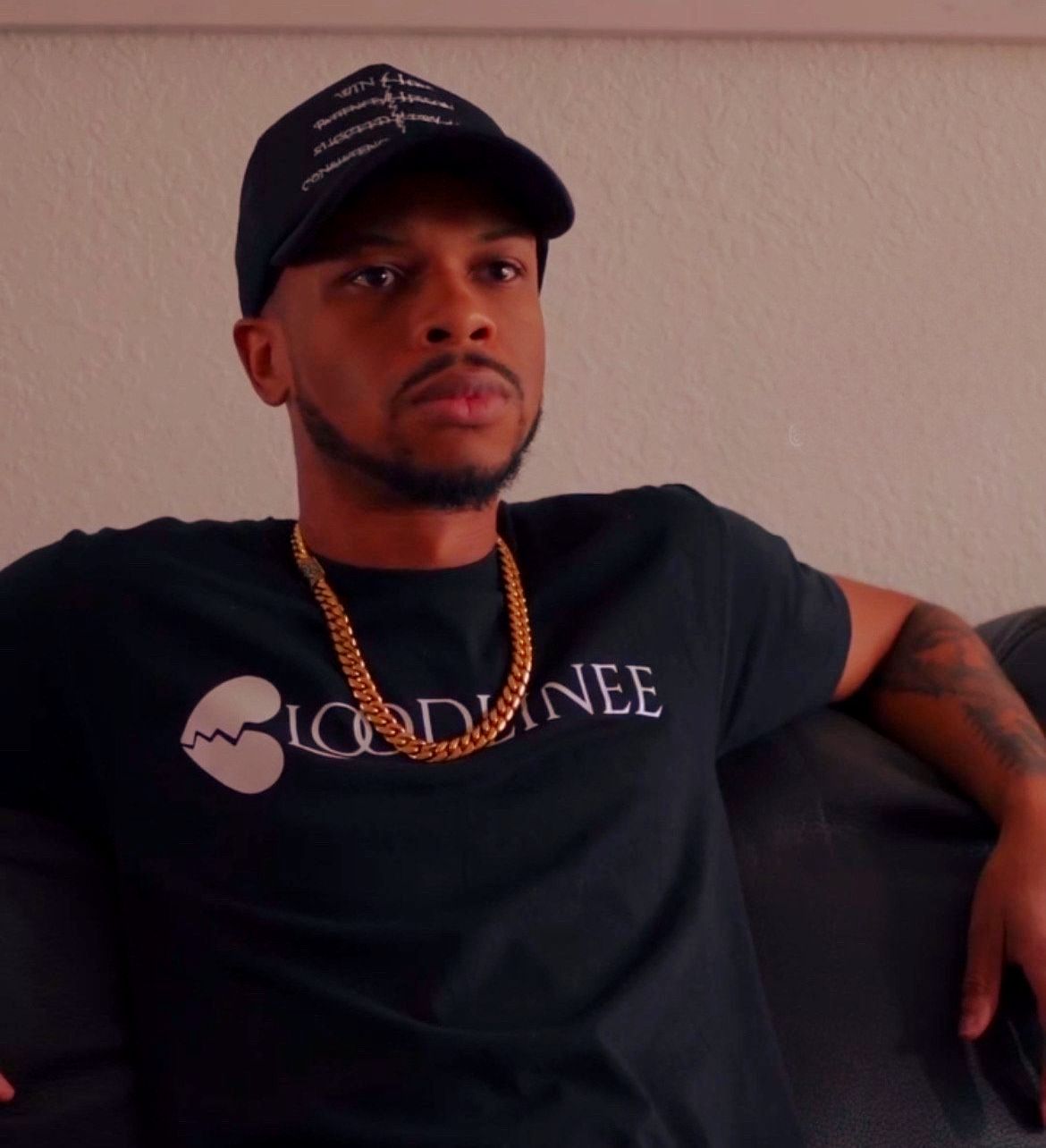 Two black trucker hats with white embroidered text: 