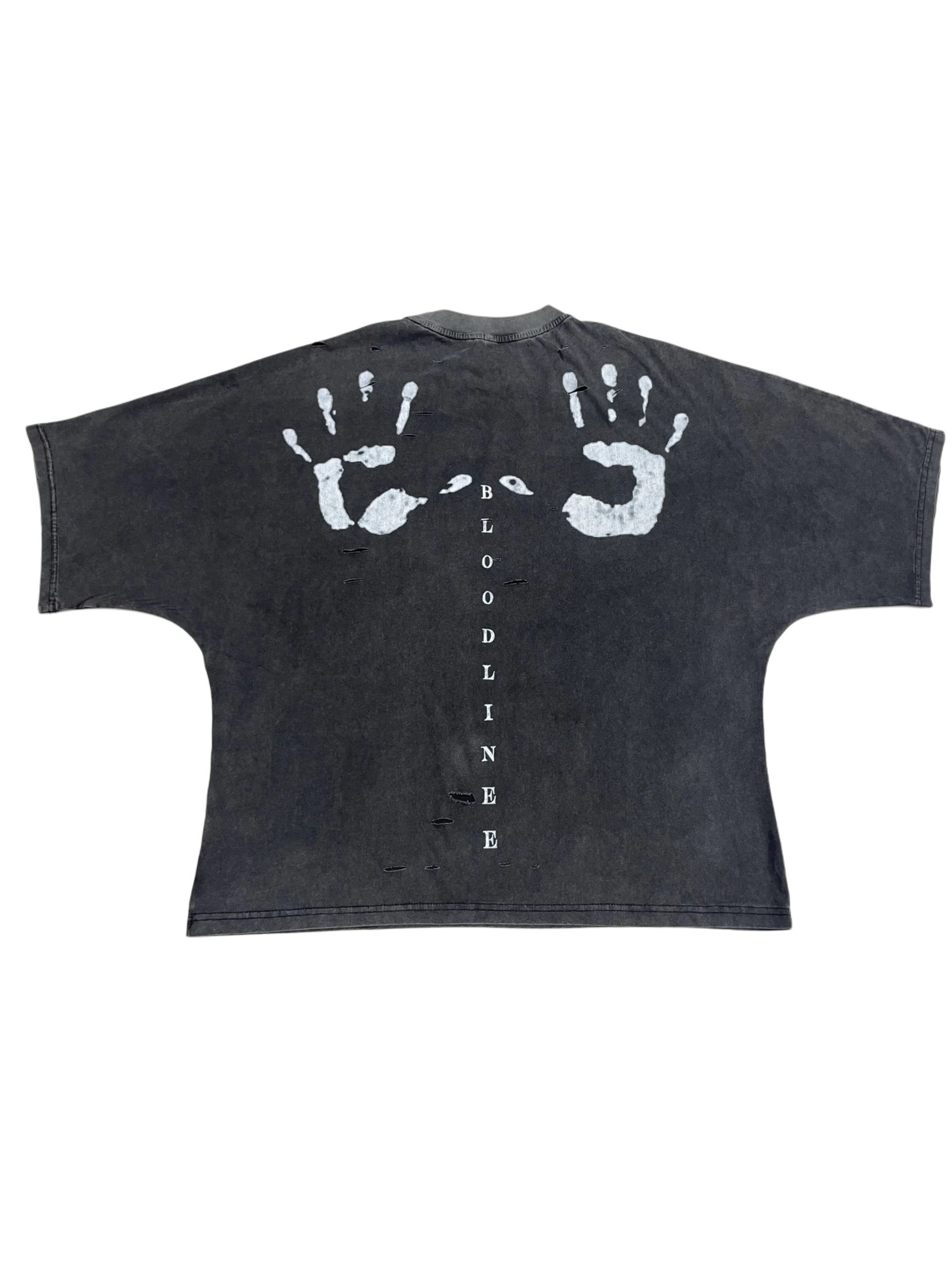 Dark gray t-shirt with a blurred, ghostly portrait of a person's face printed on the front.