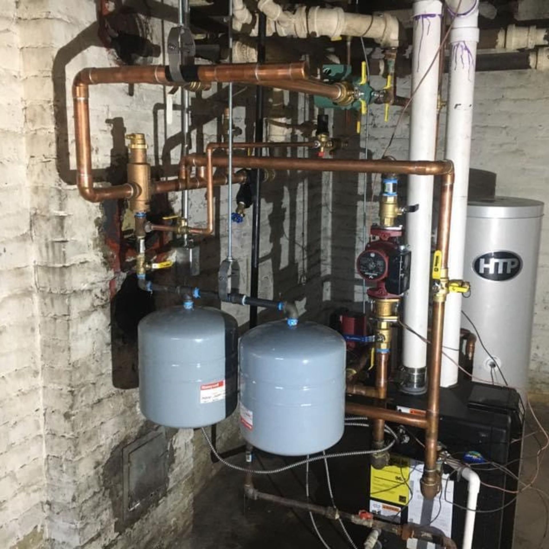 Lake Area Heating and Cooling LLC | A boiler with a htp logo on it