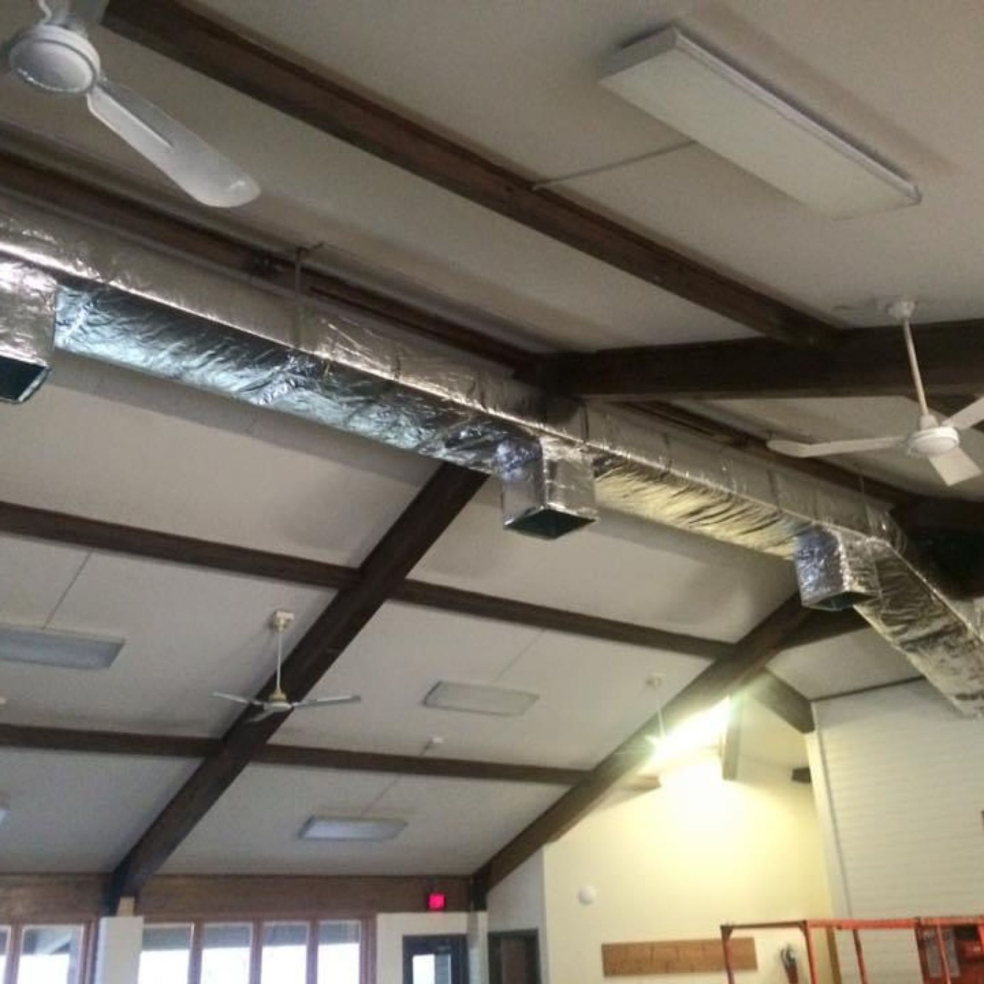 Lake Area Heating and Cooling LLC | A ceiling fan is hanging from the ceiling of a room